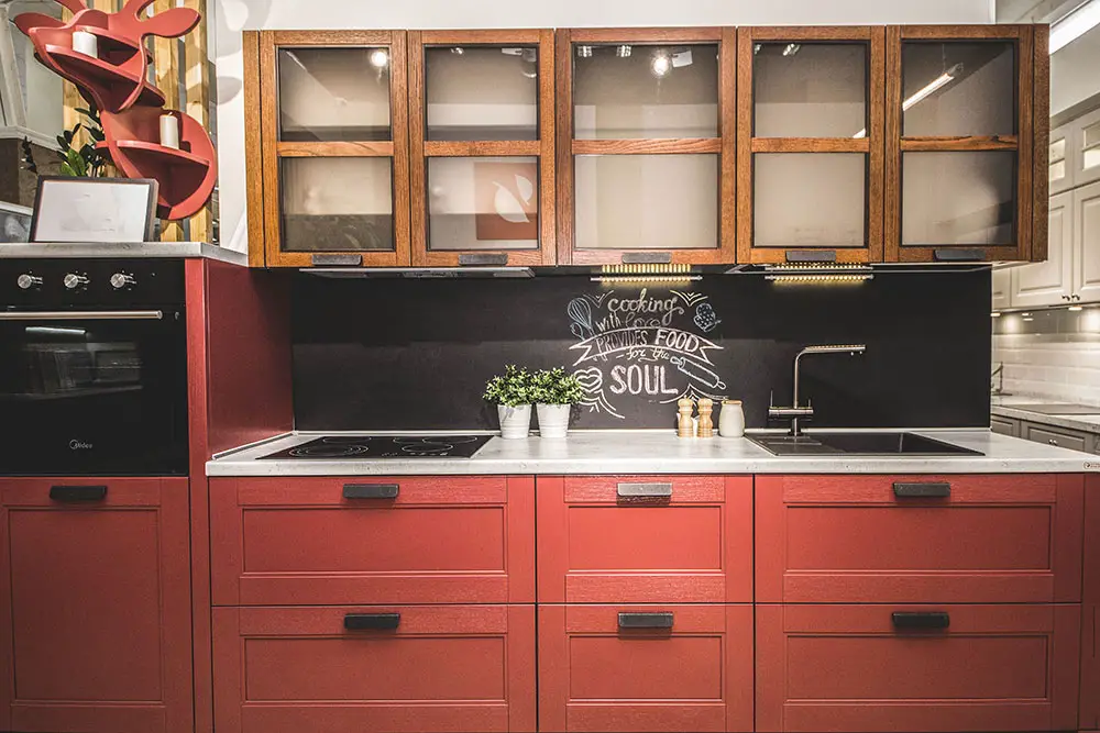 Brick red cabinets backsplash